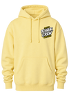 A pale yellow pullover hoodie with a drawstring hood, kangaroo pocket, and a small chest graphic reading 'MEET THE FLAVOR CREW Perry Spices' in black, white, and yellow, shown on a plain white background.